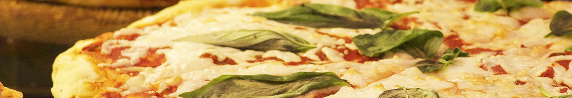 Eating Italian Pizza at Cuzino's Family Kitchen restaurant in Wilmington, DE.